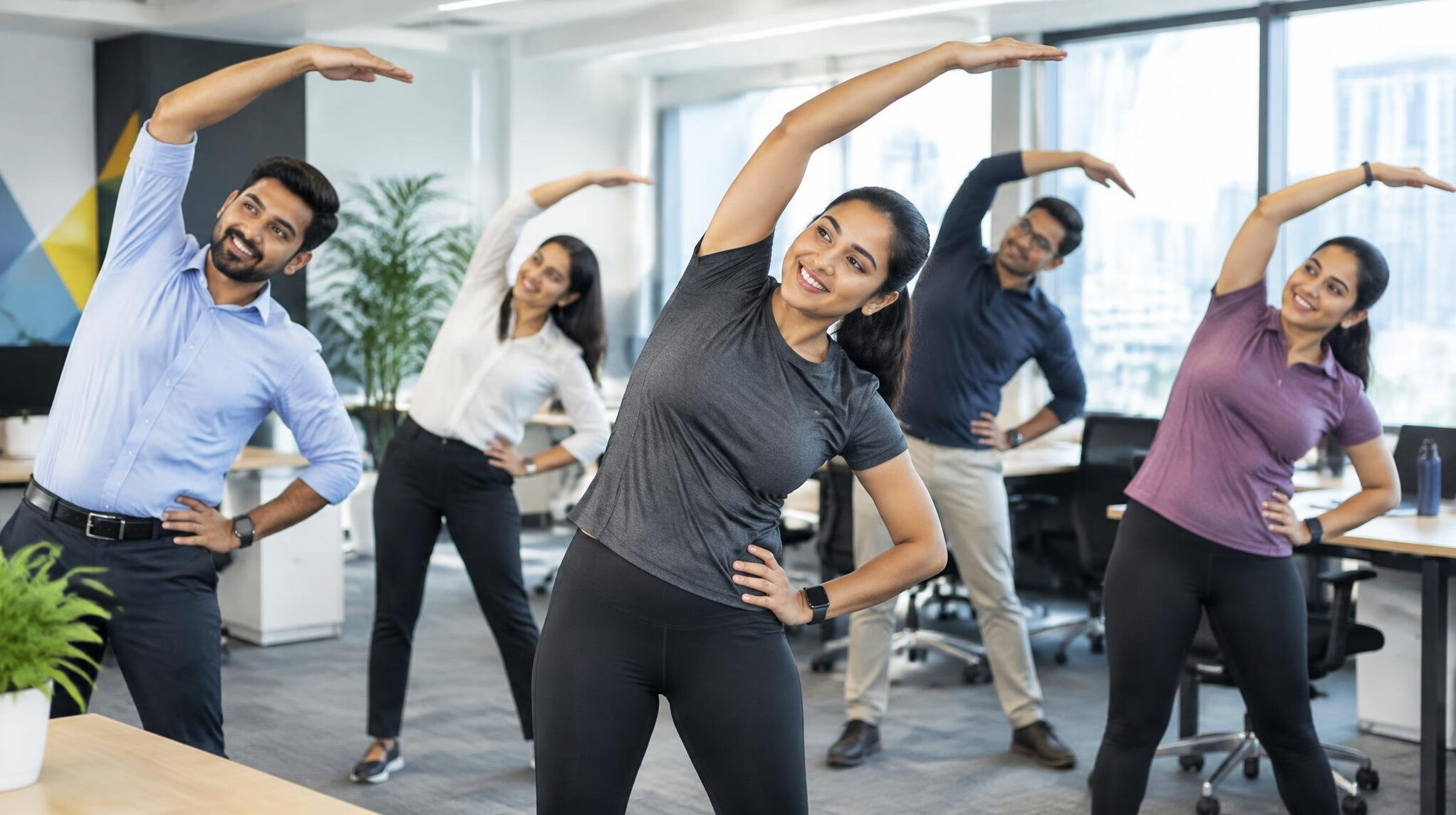 team doing morning exercises in office