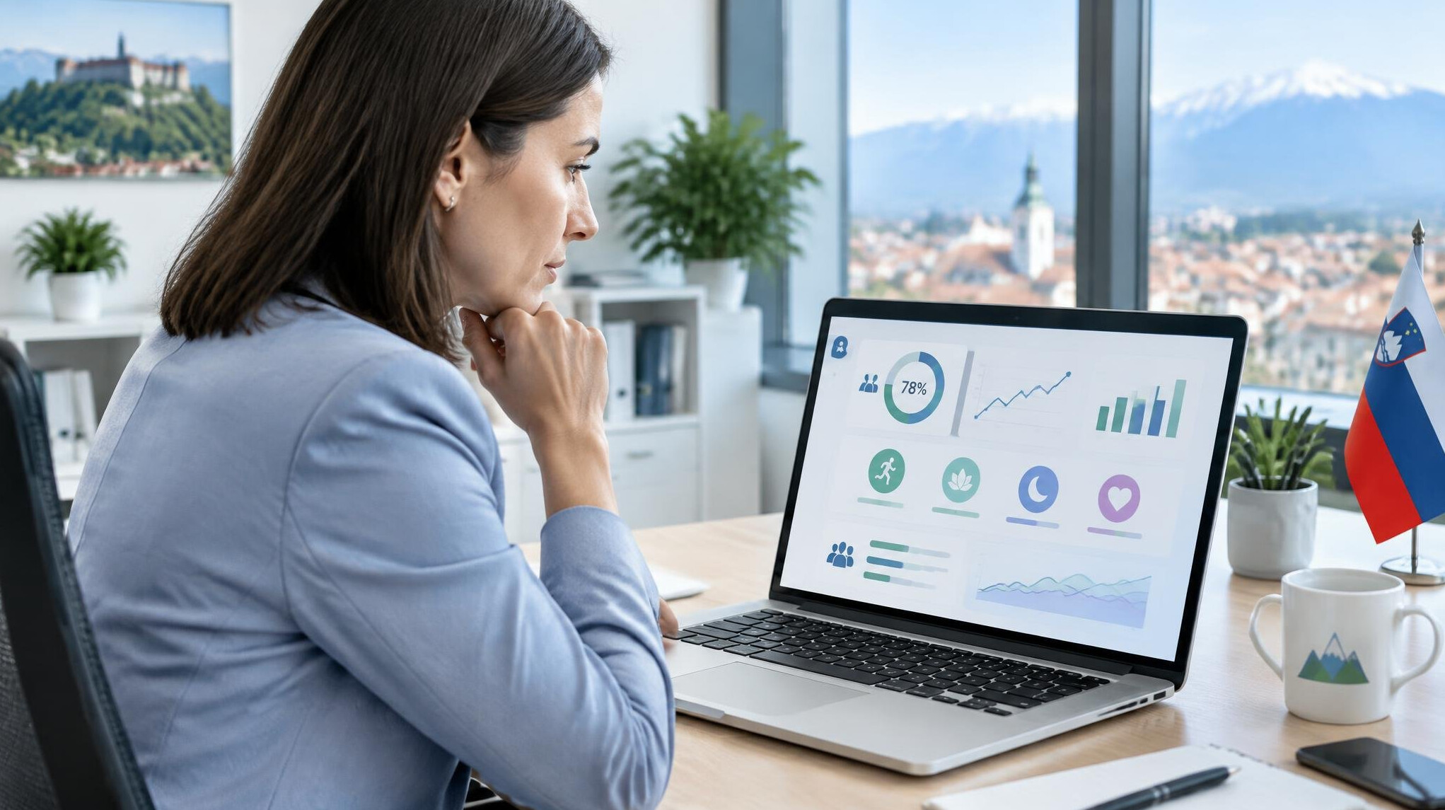 HR manager reviewing employee wellness analytics dashboard on a laptop
